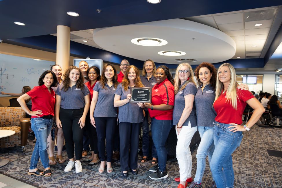 Staff members from FAU's Center for Teaching and Learning pose with the 2023 Frank L. Christ Outstanding Learning Center Award.