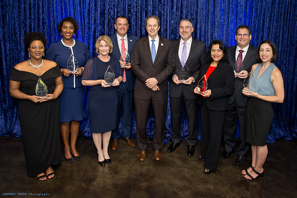 Photo 1: From left to right, Dr. Jodi-Ann Edwards; Cheryl Shields Proctor, Ph.D.; Taren J. O’Brien, R.N.; Charles L. Bender III; FAU President John Kelly; Seth L. Siegel; Belci Encinosa; Erik (Rik) J. Deitsch; and Cara Capp. 