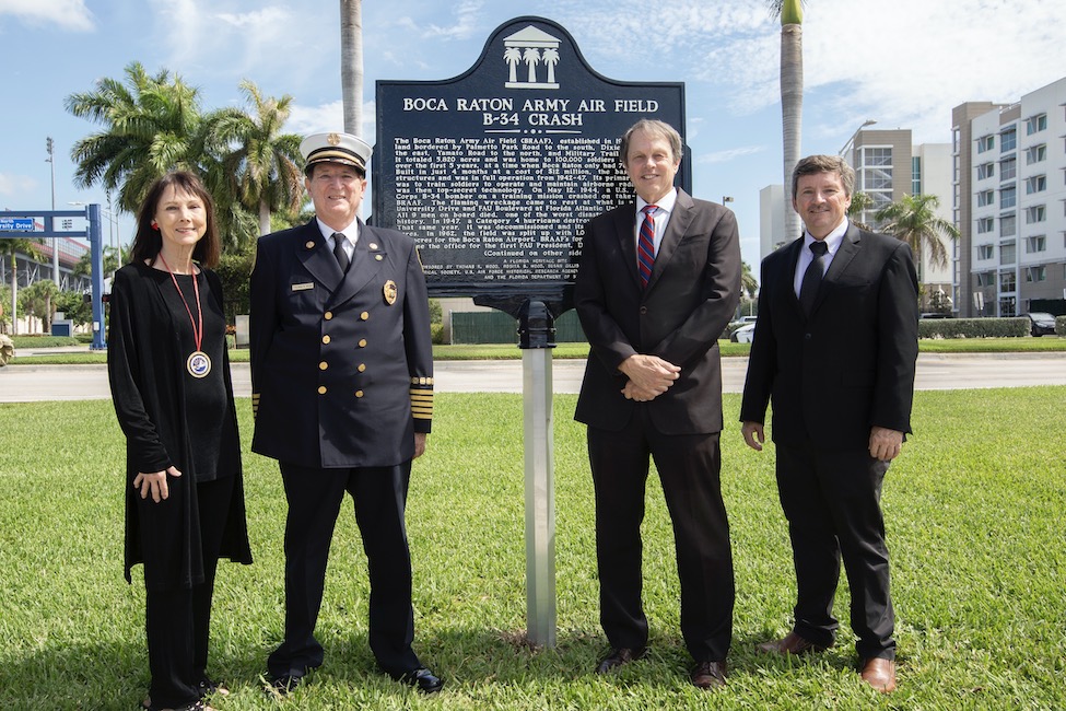 From left to right, Susan Gillis, curator at Boca Raton Historical Society and co-author of Palm Beach County During World War II; Thomas R. Wood, fire chief, Boca Raton Fire Rescue Services; FAU President John Kelly; and Daniel Flynn, Ph.D., vice president for research at FAU.