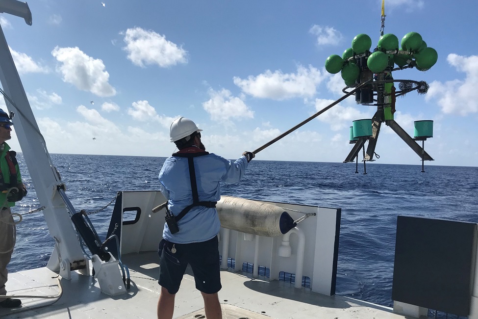 Researchers deploy a mooring, which will help them measure exchanges of waters.