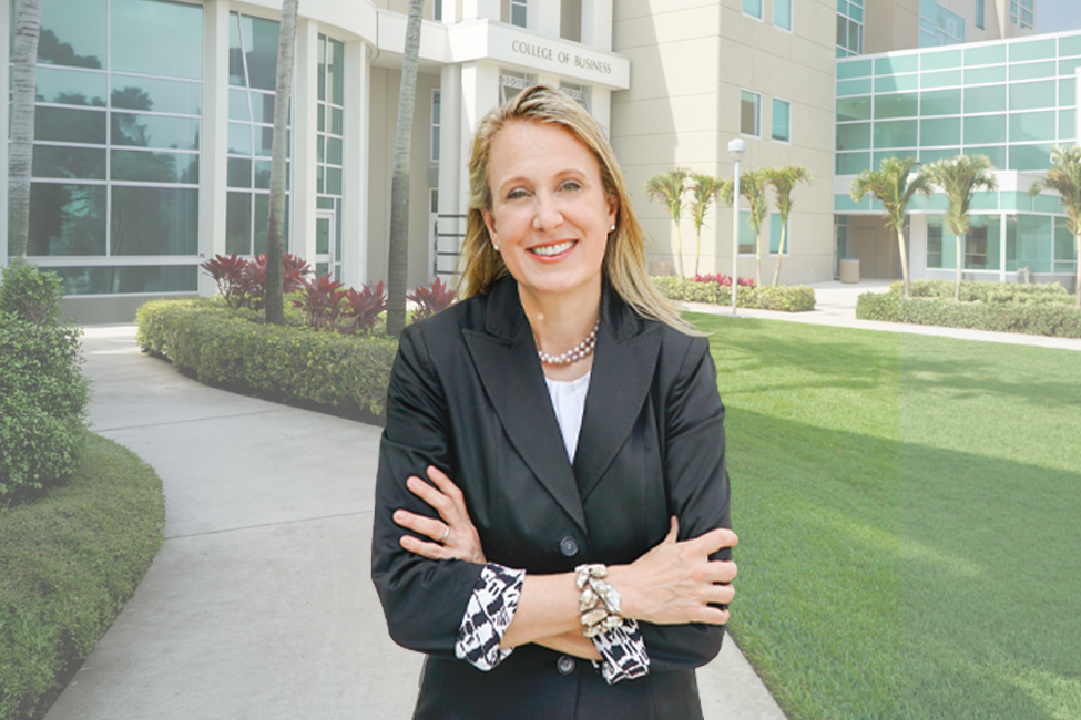 A woman stands in front of a building