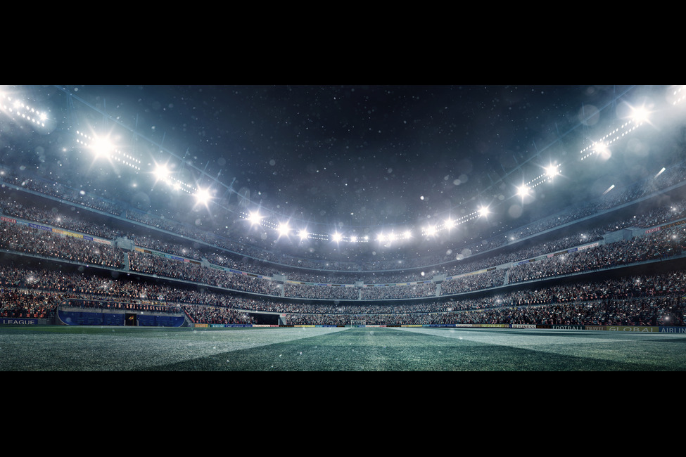 A field inside of a football stadium.