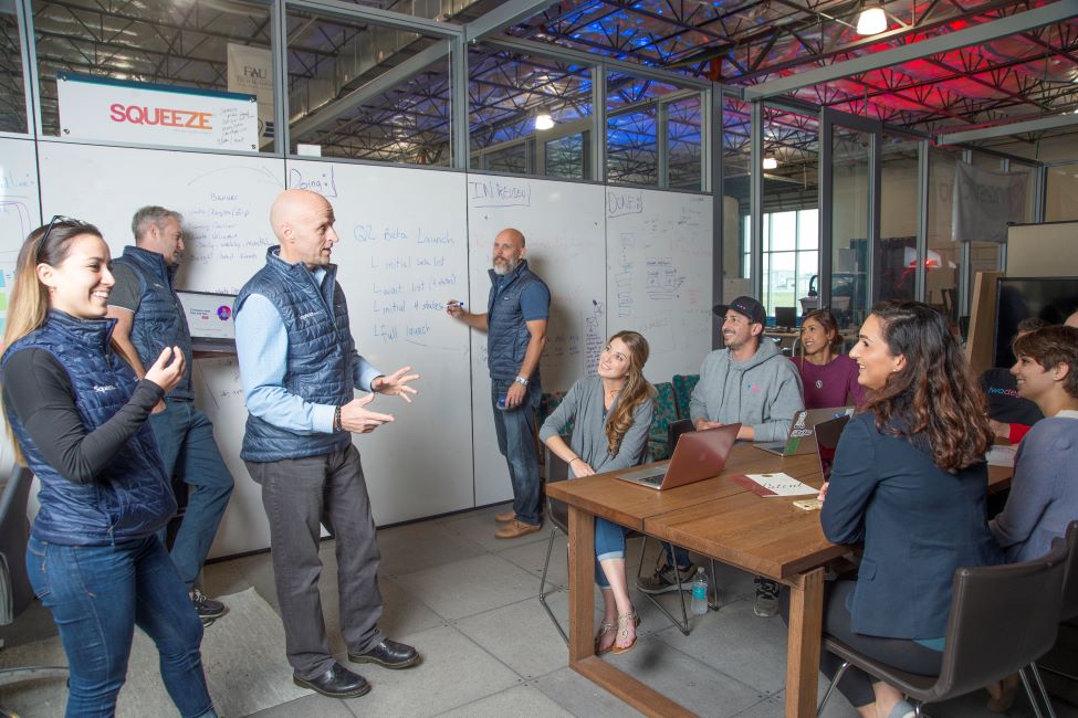 Tech Runway employees attend a presentation