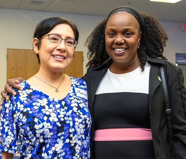 Two ladies smiling