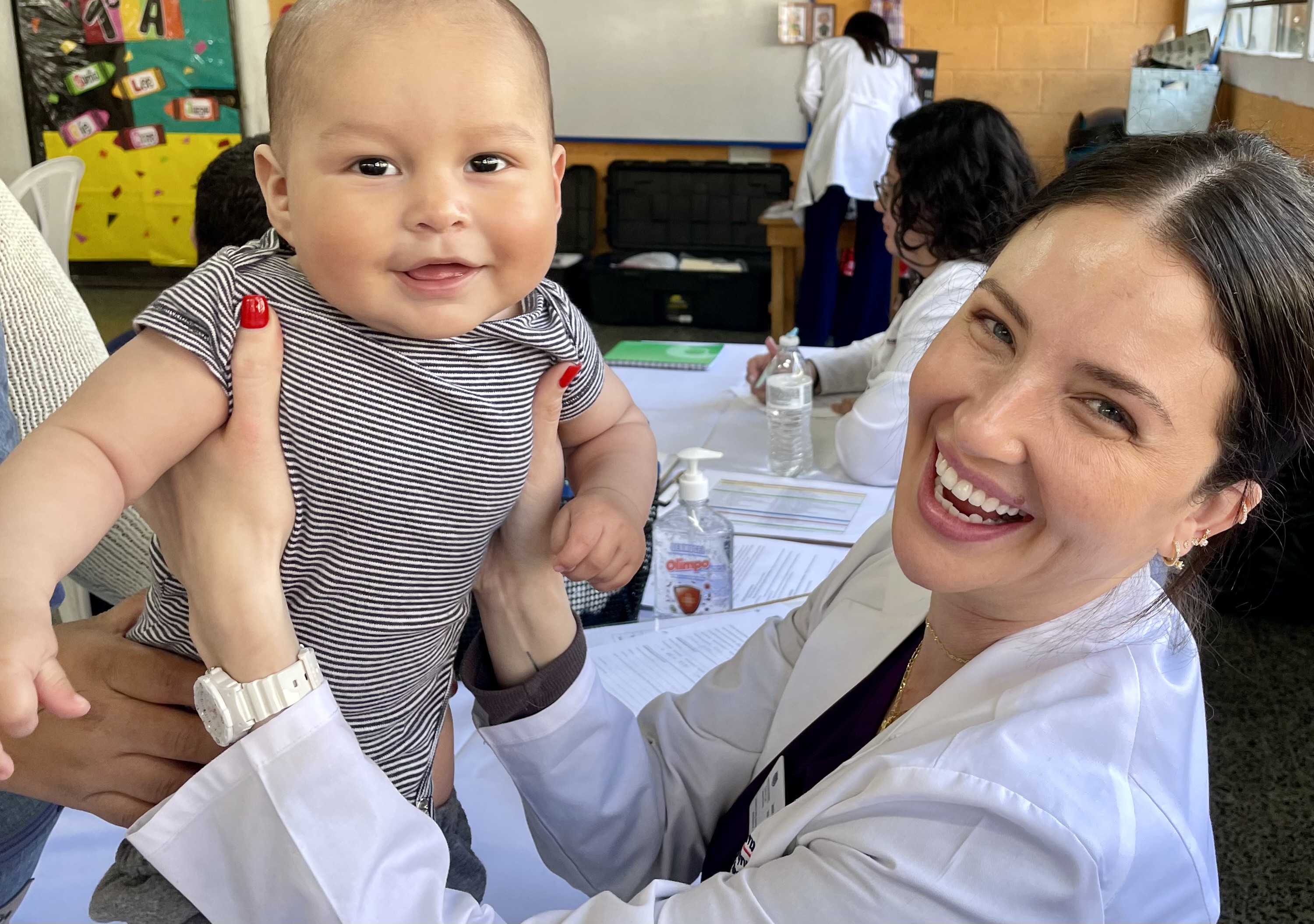 Nursing student with a child patient in Guatemala, Feb. 2026