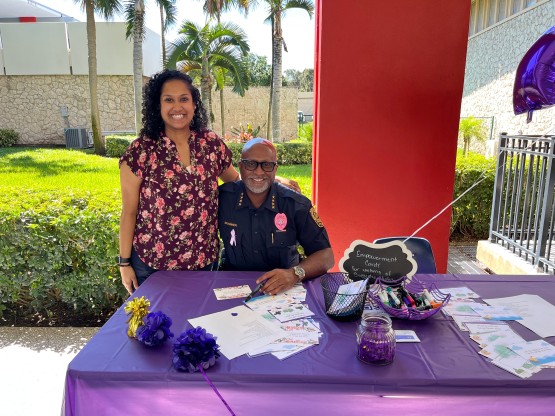 Photo depicts the Chief of FAU Police standing with Victim Services' director, Candace Harrinarine at an event.