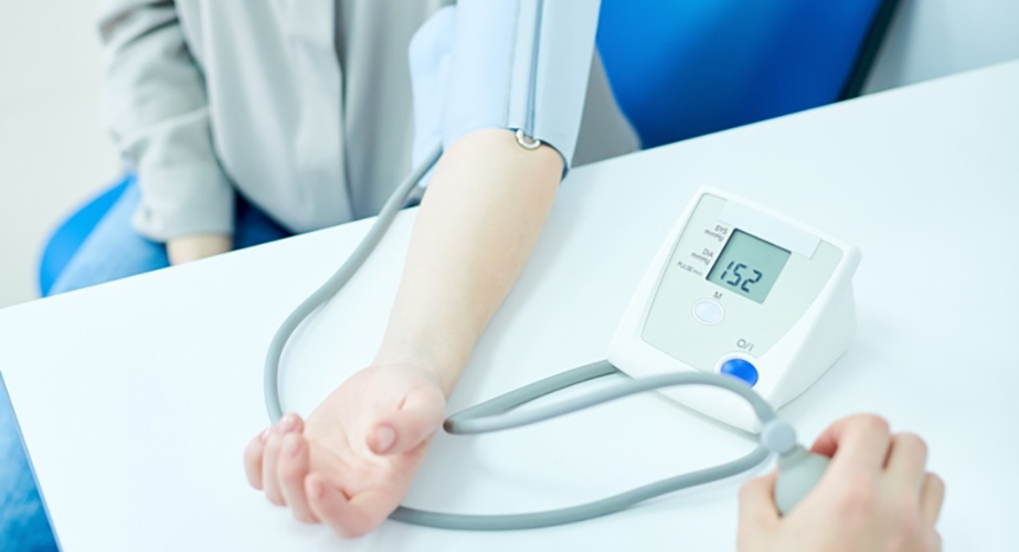 arm with blood pressure cuff