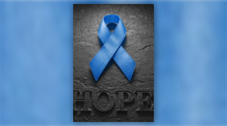 bright blue cancer ribbon on dark textured background with word 'Hope' beneath it