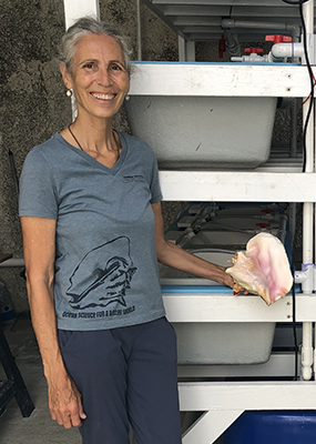 Megan Davis holding a conch shell