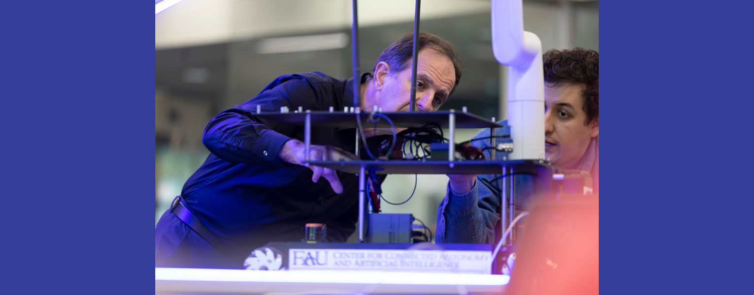 Two men looking at equipment in lab setting