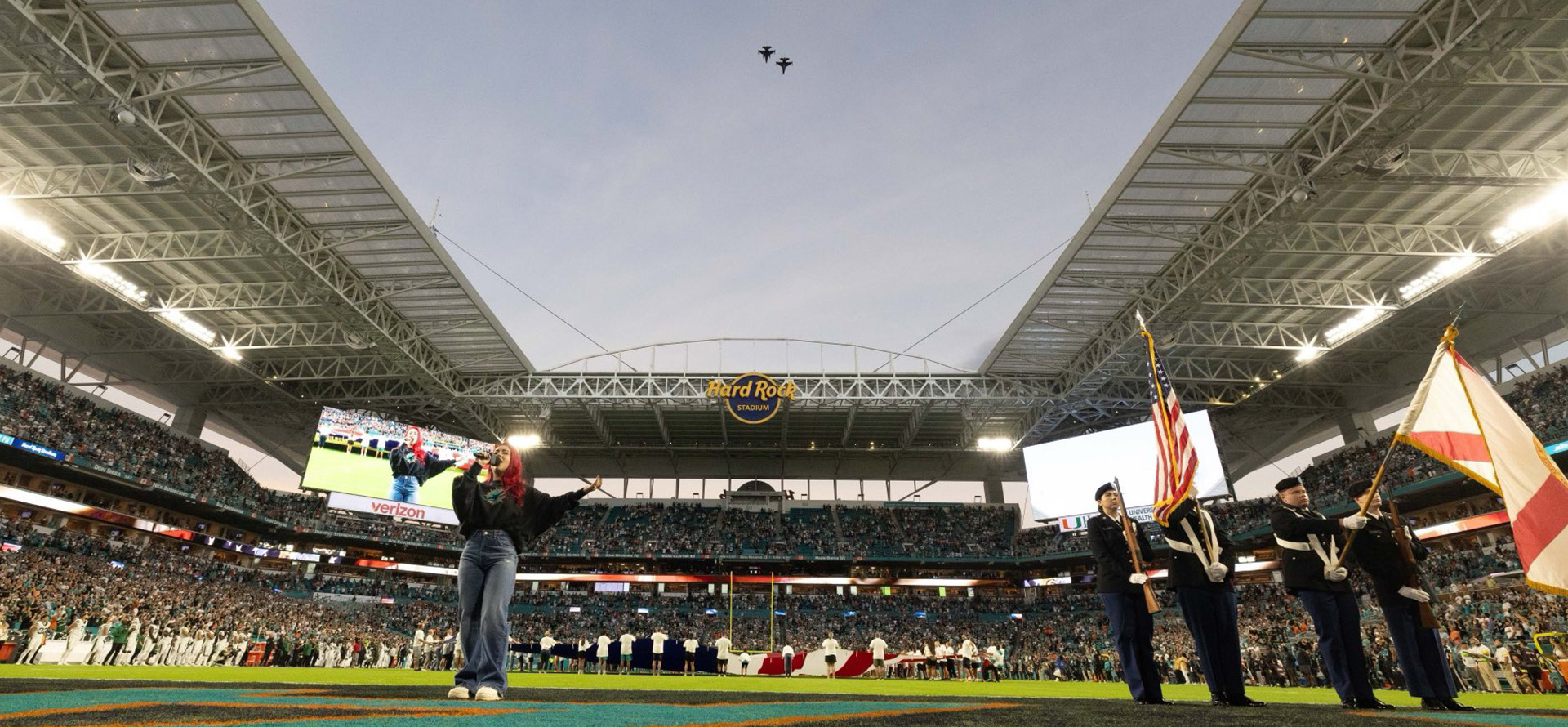 FAU Student singing the national anthem