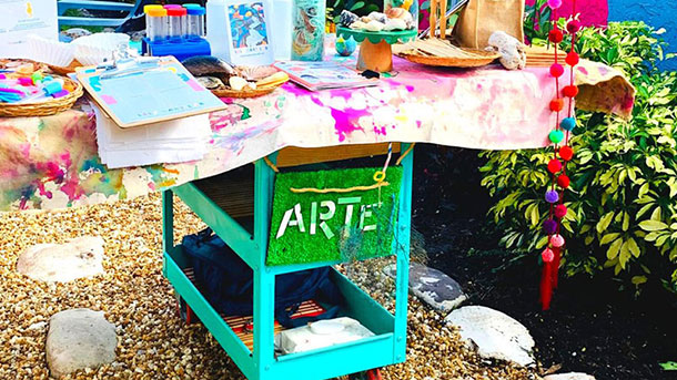 cart with art supplies in a garden