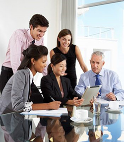 A business team looking at a tablet