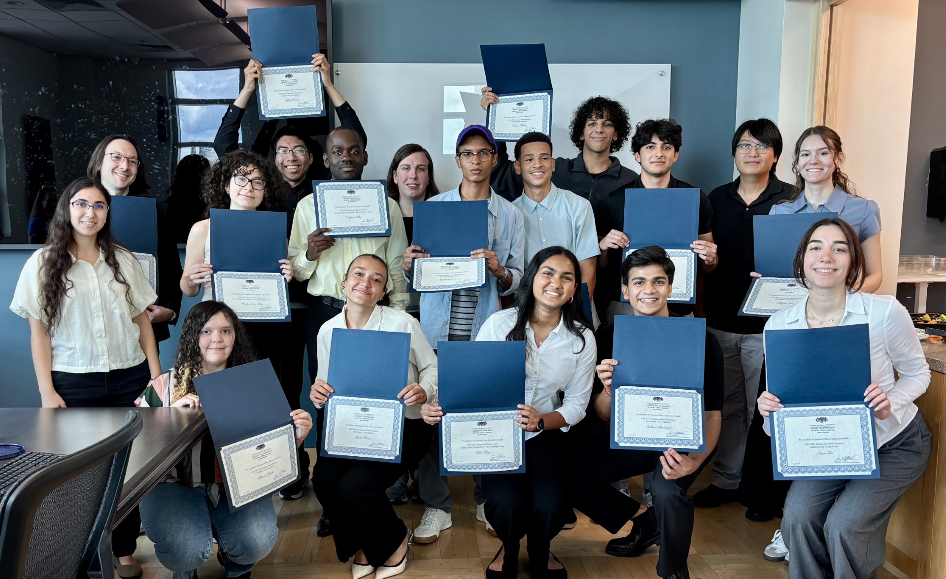students holding certificates