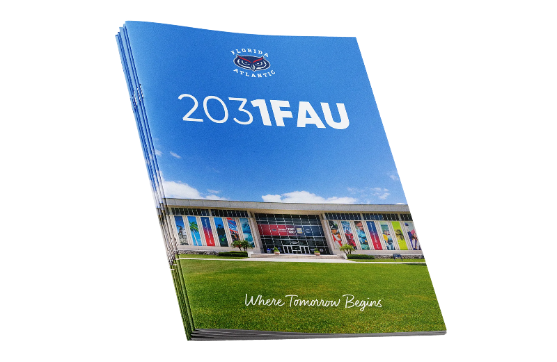 A stack of blue Florida Atlantic University brochures featuring the text '2031FAU', a photo of a campus building with a green lawn, and the tagline 'Where Tomorrow Begins'.
