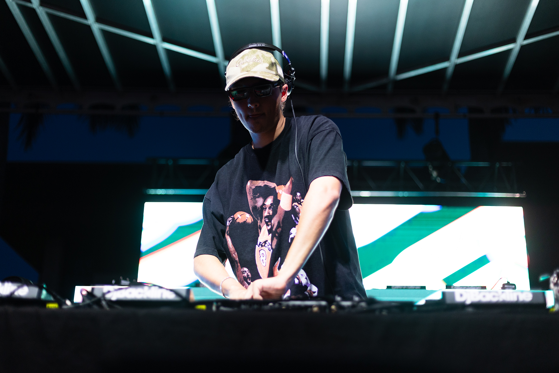 A dramatic shot of a DJ performing on stage