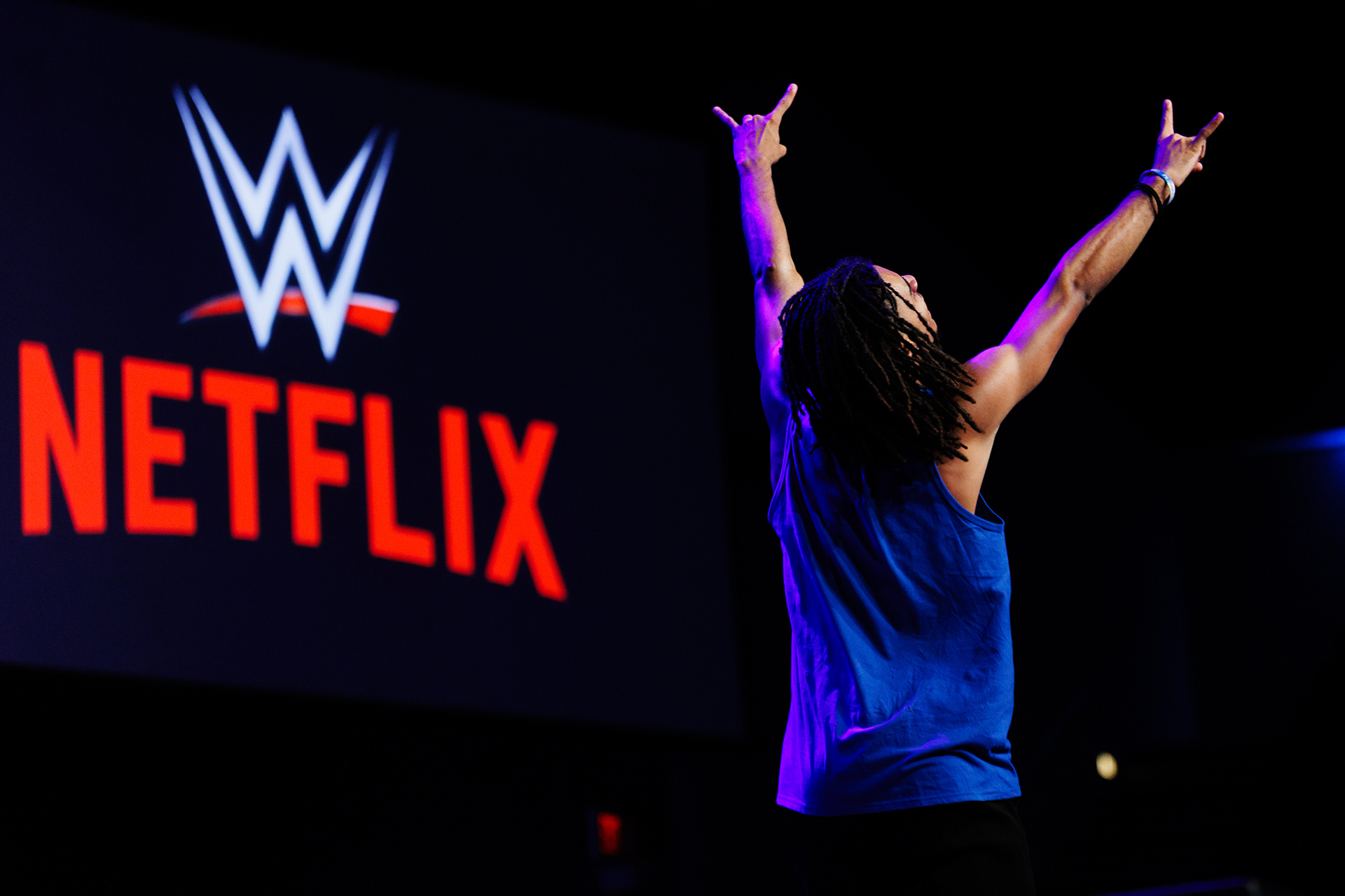 A student stretching his hands into the air at the Step Show