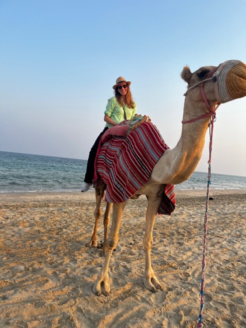 Colvin riding a camel