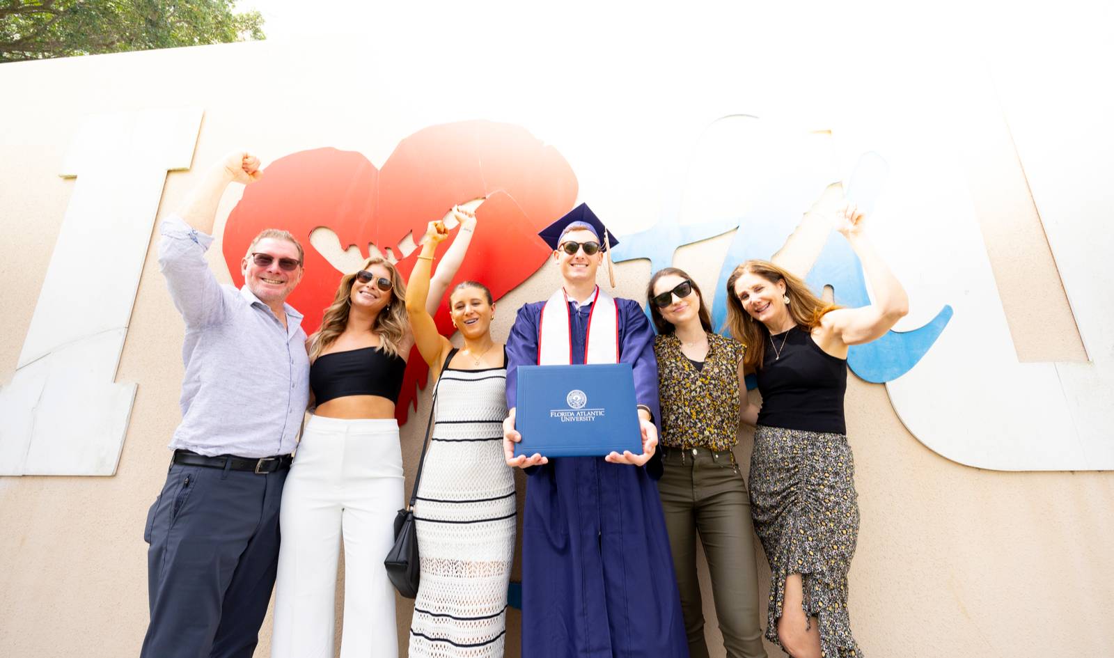 A graduate with his family