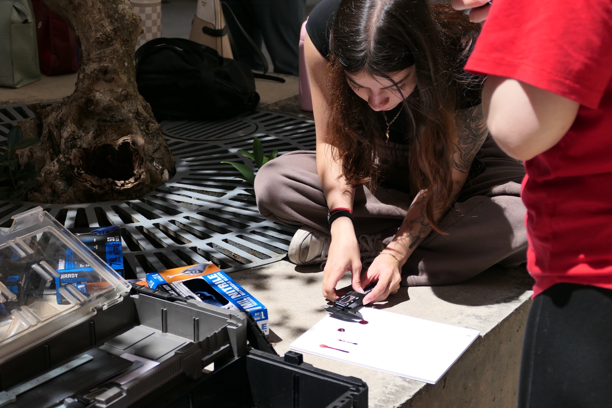 Student performing blood splatter analysis