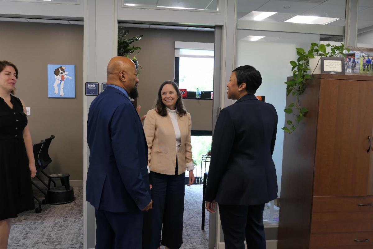 Three people in a conversation