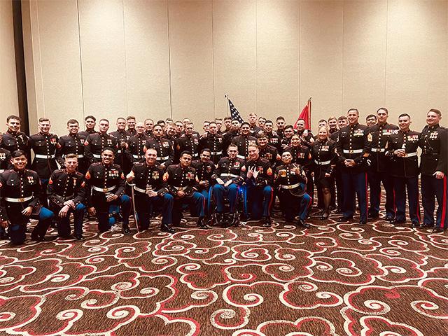 group portrait of Marine Corp service members in a ballroom
