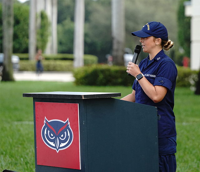a police officer giving remarks at the podium 
