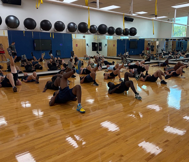 Students stretching on the studio floor at the MVSS Challenge