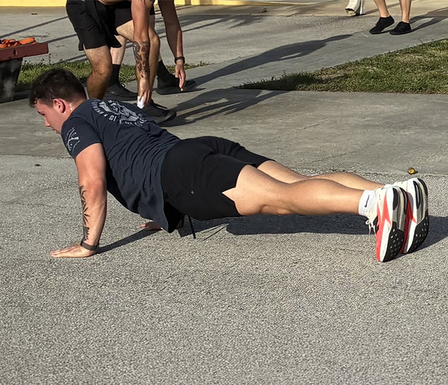 Students doing push ups at the MVSS Challenge