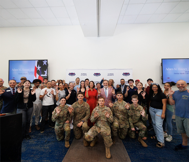 group shot of Military students and FAU president